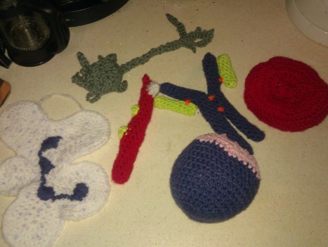 A collection of crocheted cells and an antibody
